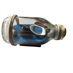 Decorative Glass Bottle With Blue Sand And Seashells